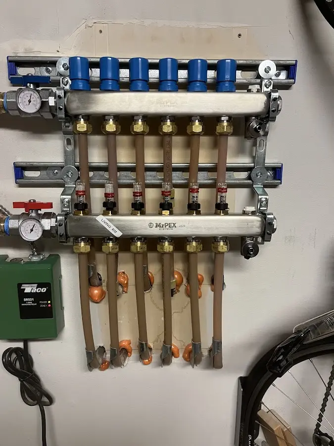 Plumber performing Water Heater Repair at a residential property in Olathe